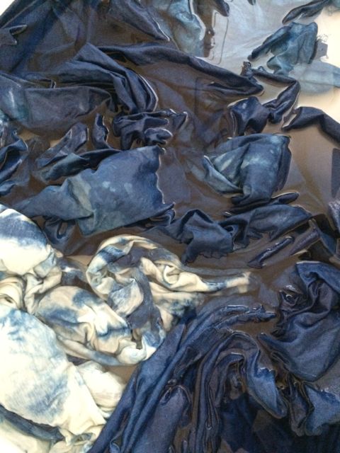 Rinsing the dyed fabric pieces.