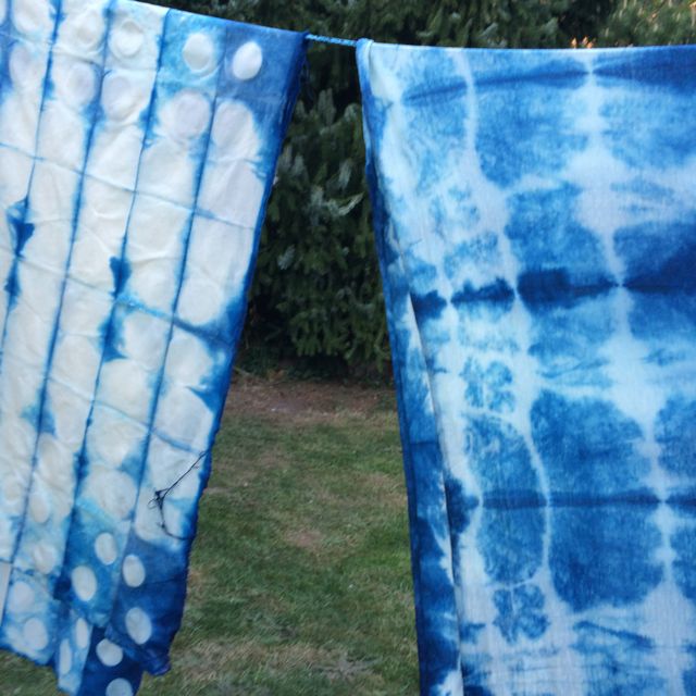 Shibori - the fabric on the left was clamped with wooden circular pieces and the piece on the right was folded and tied with string.